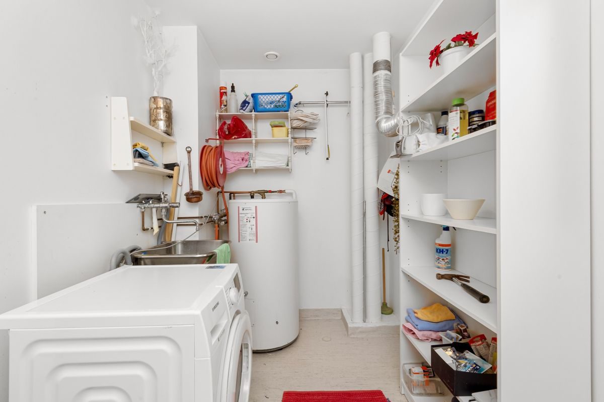 New water heater installed in a laundry room
