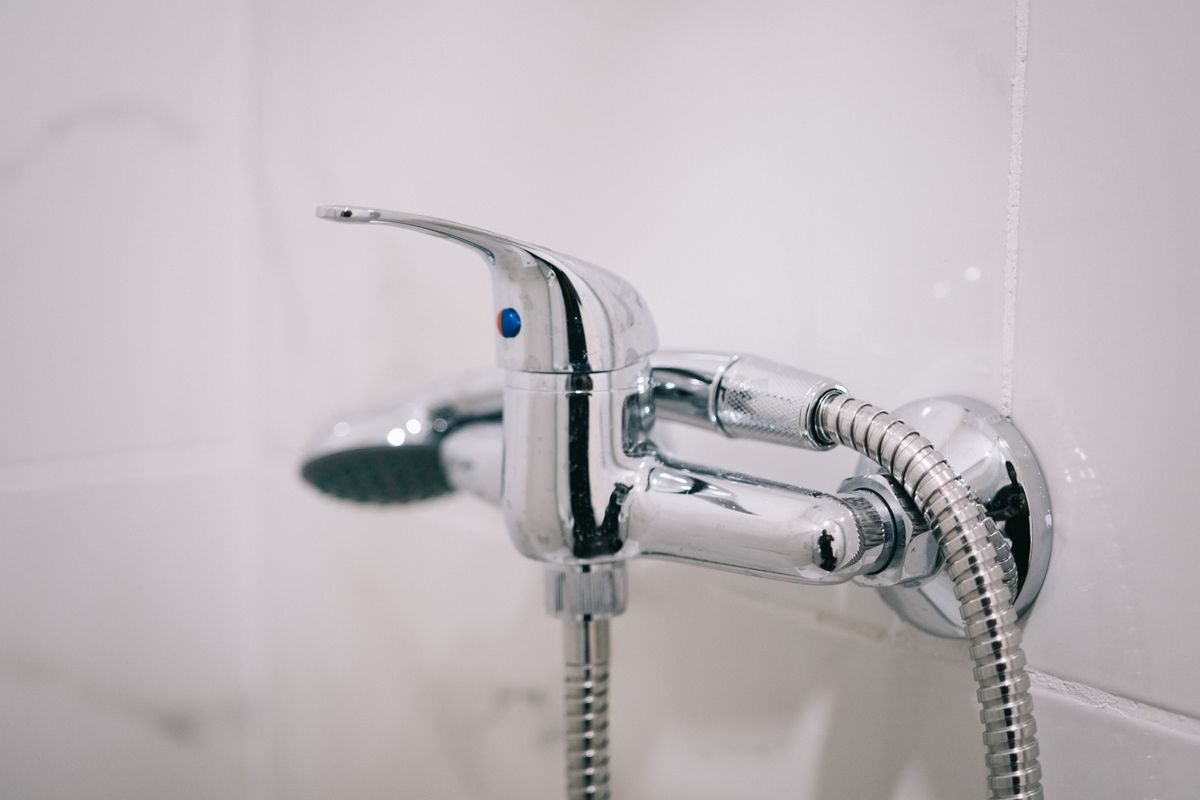 Chrome shower faucet in a finished bathroom