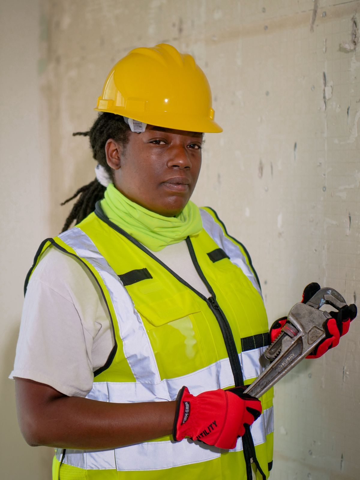 Smiling FlowRight technician in uniform and hard hat